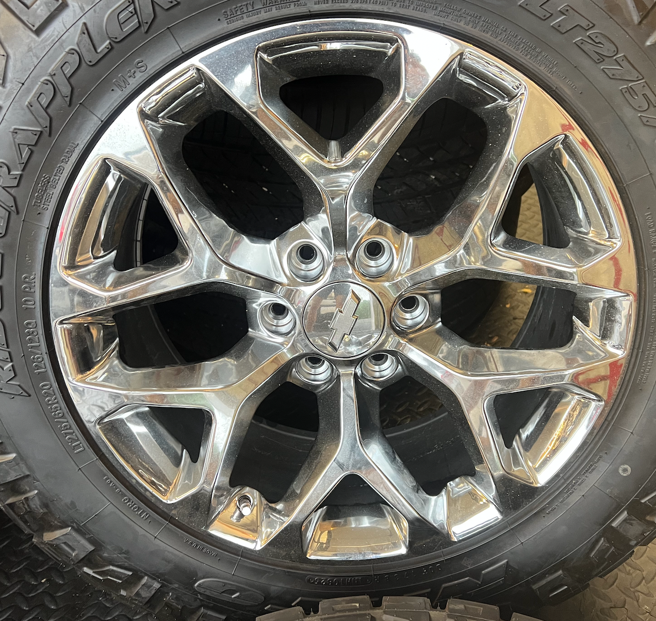 OEM 20” Chrome Truck Wheels wrapped in Nitto Ridge Grappler tires.