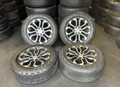 OEM 20” Charcoal Machined Wheels wrapped in Bridgestone Dueler A/T tires.