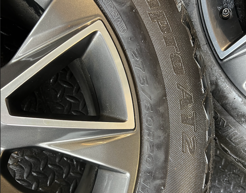 OEM 20” Wheels wrapped in Hankook Dynapro AT2 tires.
