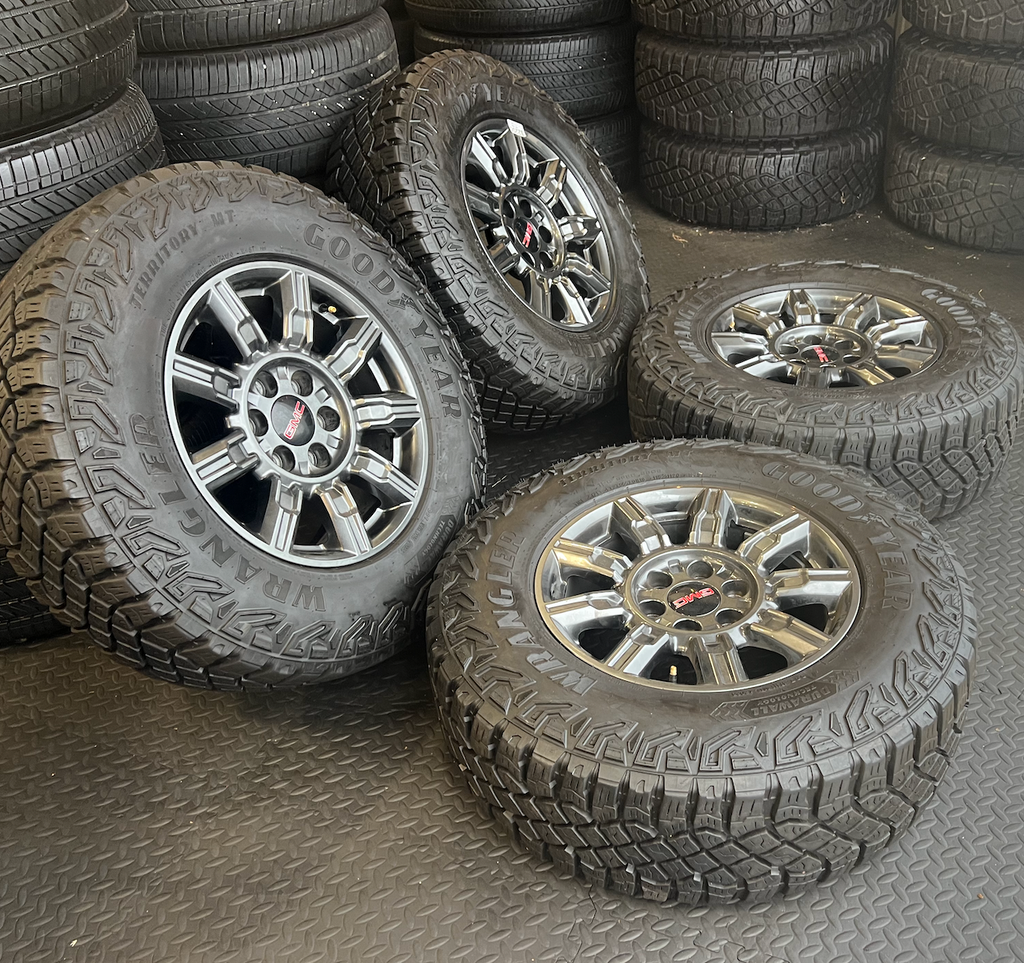 OEM 18” AT4X machined aluminum Wheels wrapped in Goodyear Wrangler Territory M/T tires.