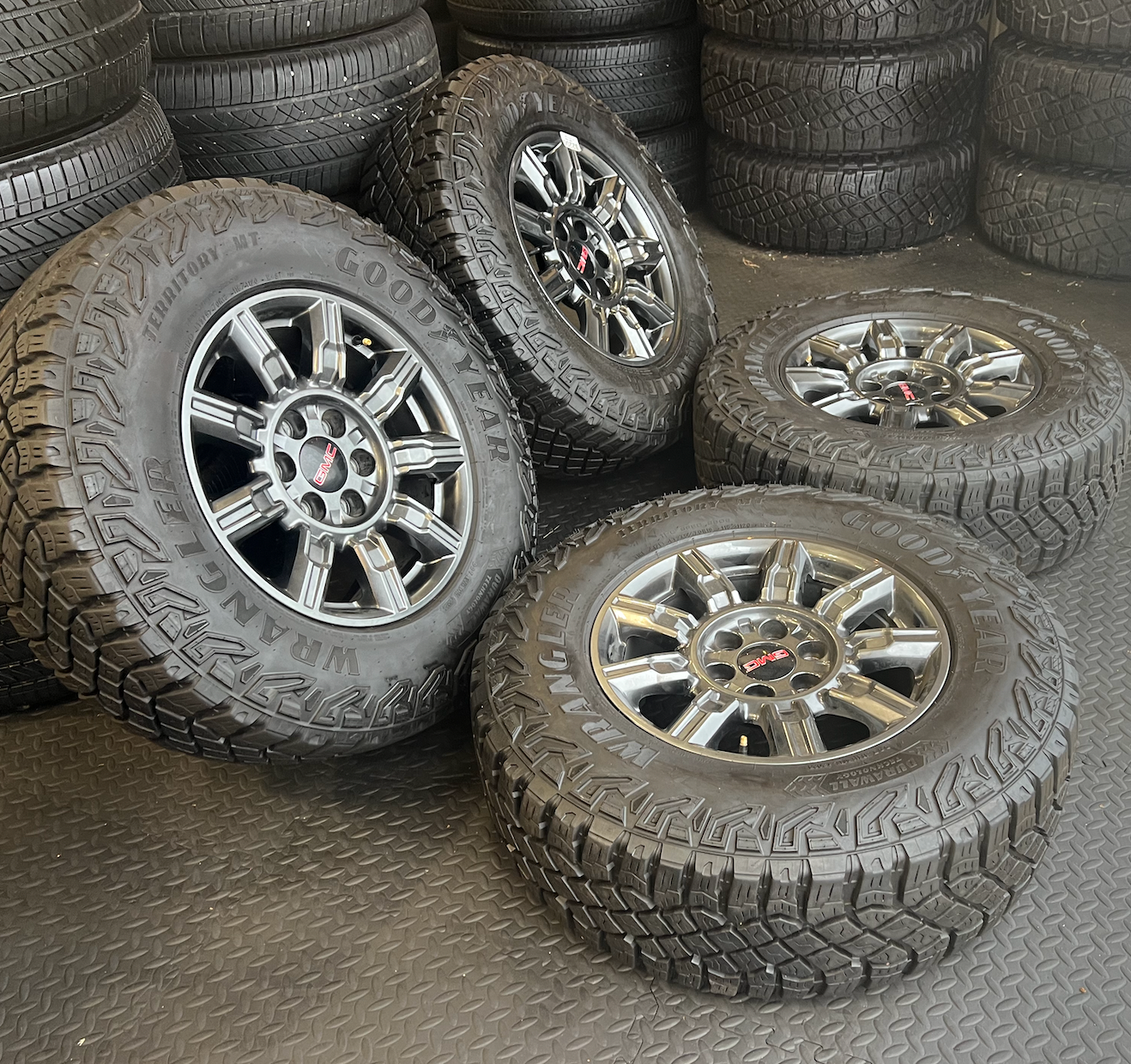 OEM 18” AT4X machined aluminum Wheels wrapped in Goodyear Wrangler Territory M/T tires.