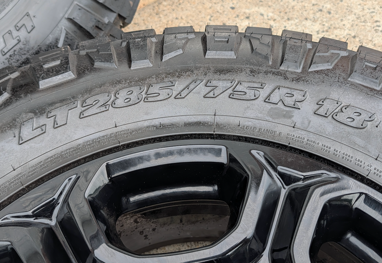 Gloss Black Ford F-250 / F-350 Super Duty OEM 18” Wrapped in Nitto Ridge Grappler LT285/75R18