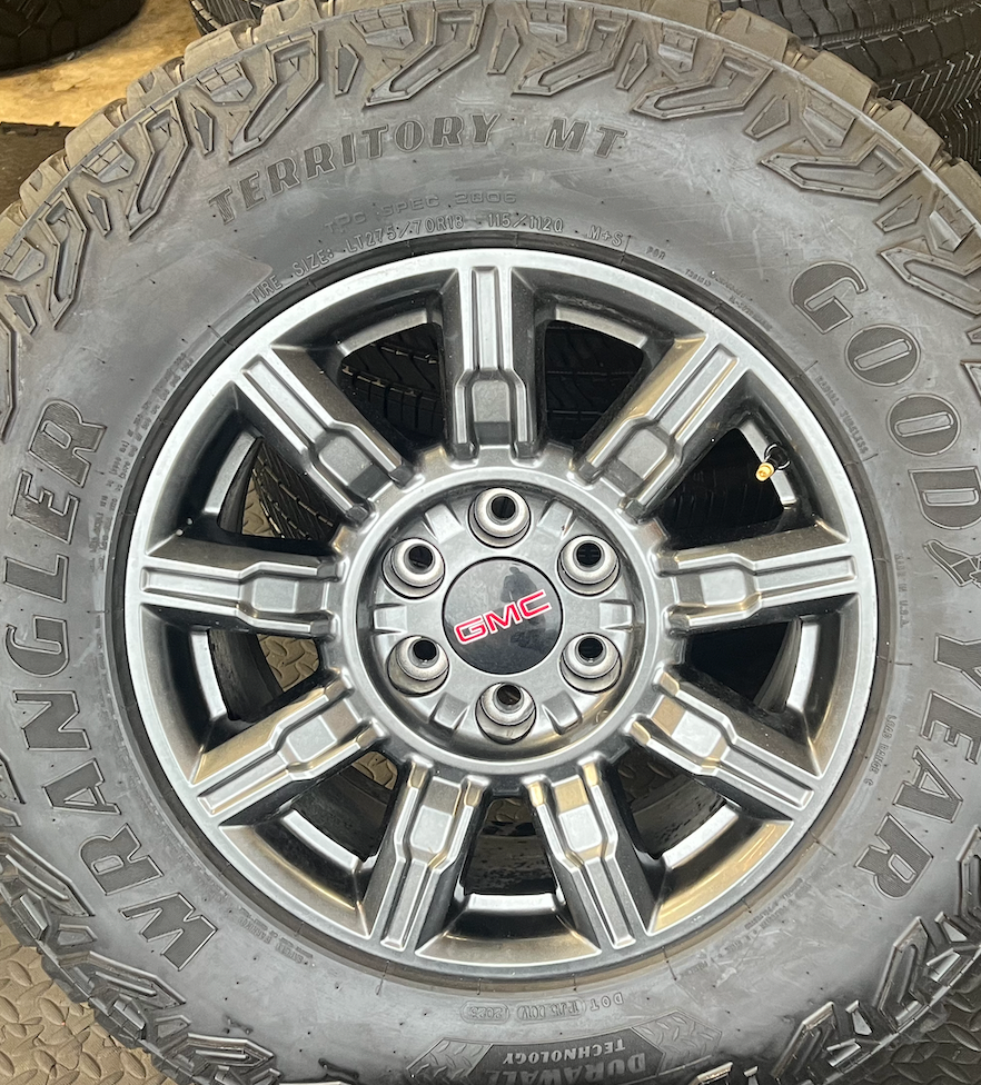 OEM 18” AT4X machined aluminum Wheels wrapped in Goodyear Wrangler Territory M/T tires.