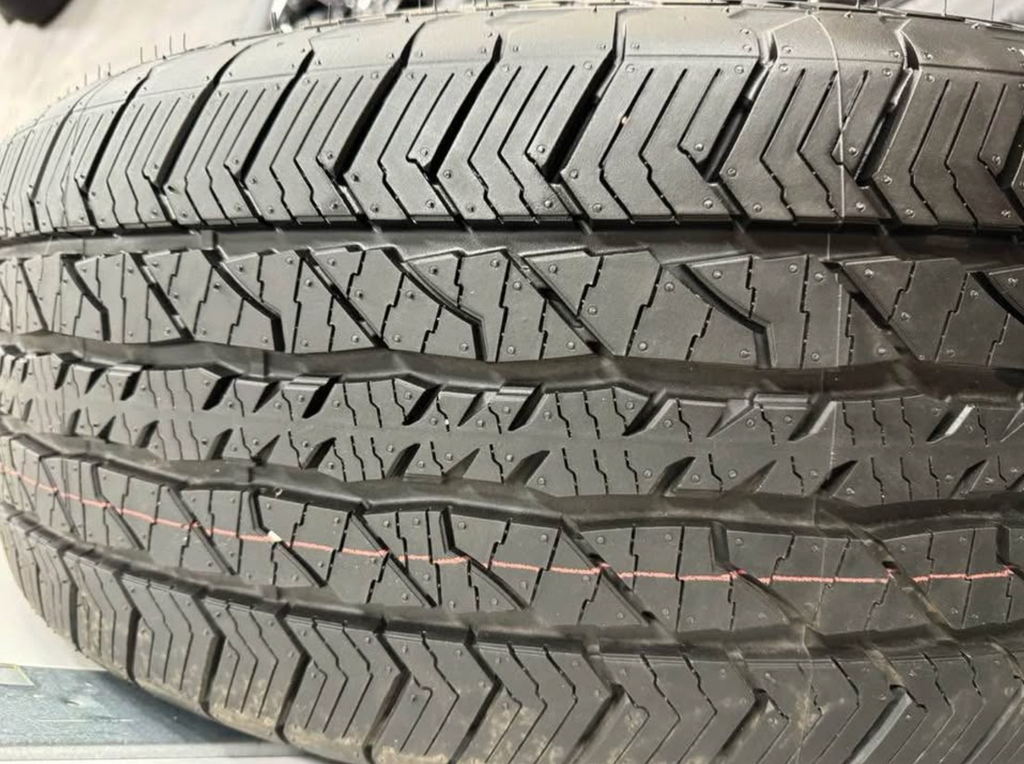 2026 F-150 Lariat black appearance OEM wheels wrapped in 275/60/20 Hankook Dynapro at2 tires