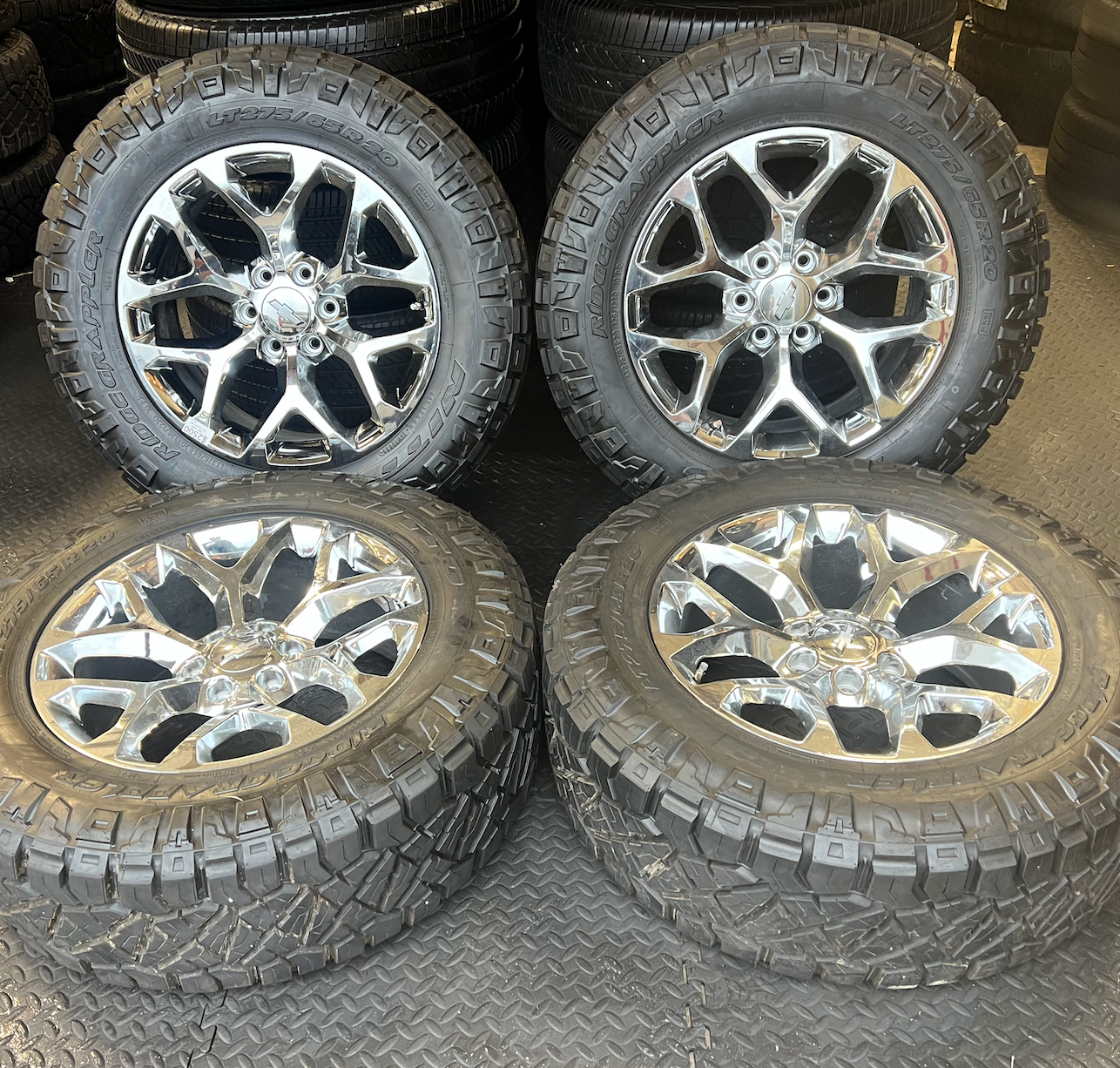 OEM 20” Chrome Truck Wheels wrapped in Nitto Ridge Grappler tires.