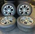 OEM 20” Chrome Wheels wrapped in Bridgestone Dueler tires.