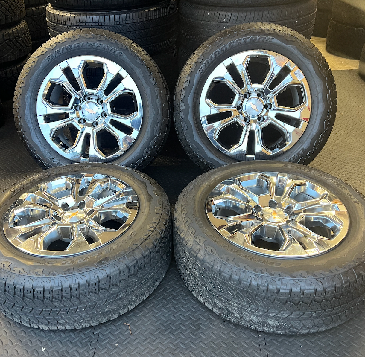 OEM 20” Chrome Wheels wrapped in Bridgestone Dueler tires.