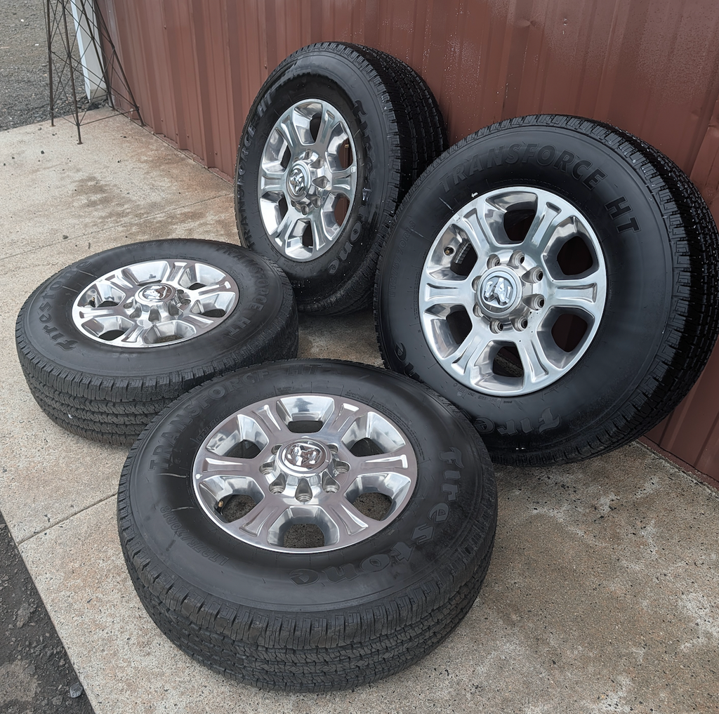 Polished Aluminum Ram 2500 / 3500 OEM 18” Wrapped in Firestone Transforce HT LT275/70R18