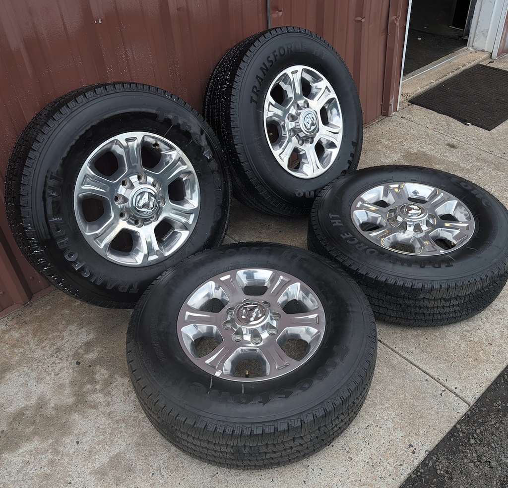 Polished Aluminum Ram 2500 / 3500 OEM 18” Wrapped in Firestone Transforce HT LT275/70R18
