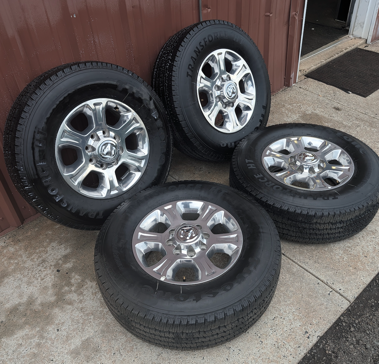 Polished Aluminum Ram 2500 / 3500 OEM 18” Wrapped in Firestone Transforce HT LT275/70R18