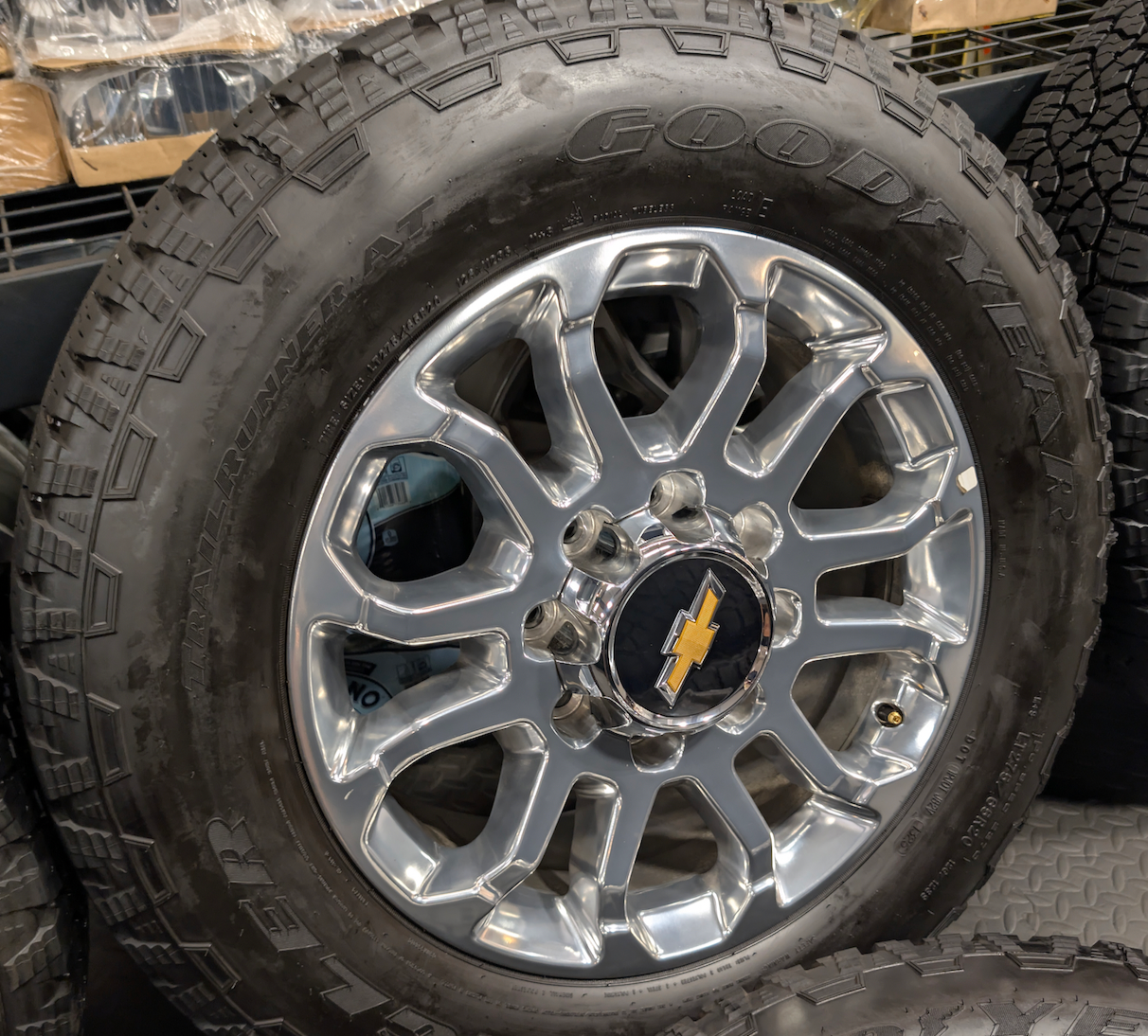 Polished Chevrolet Silverado 2500HD / 3500HD LTZ OEM 20” Wrapped in Goodyear Wrangler TrailRunner A/T LT275/65R20