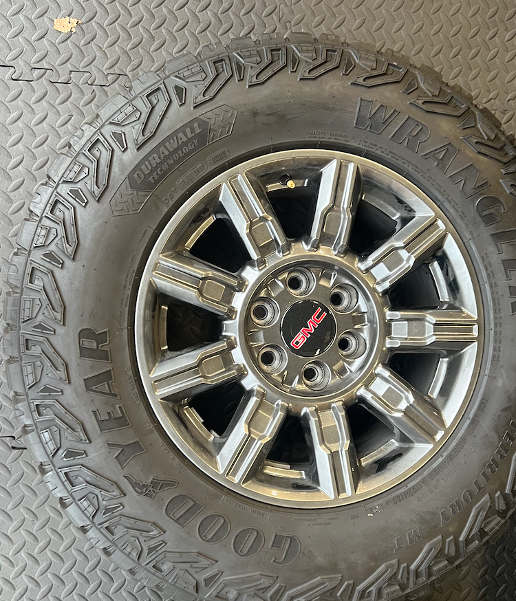 OEM 18” AT4X machined aluminum Wheels wrapped in Goodyear Wrangler Territory M/T tires.