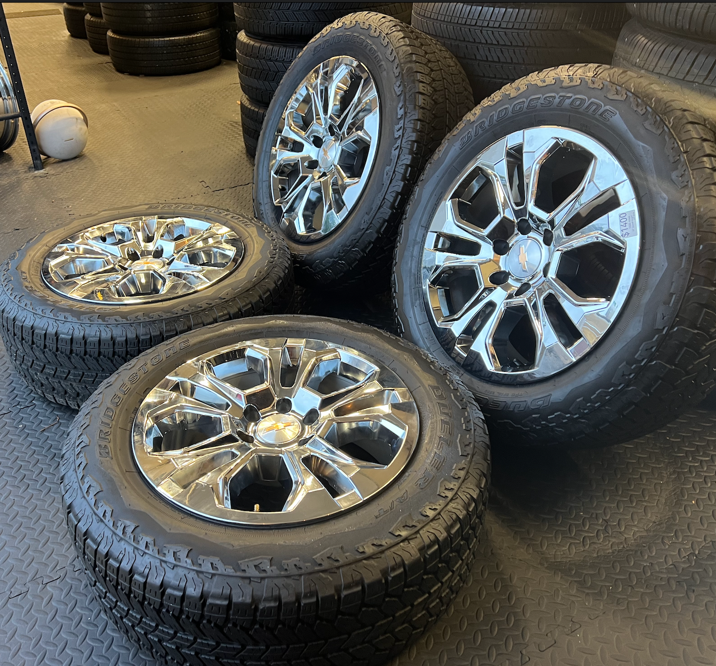 OEM 20” Chrome Wheels wrapped in Bridgestone Dueler tires.