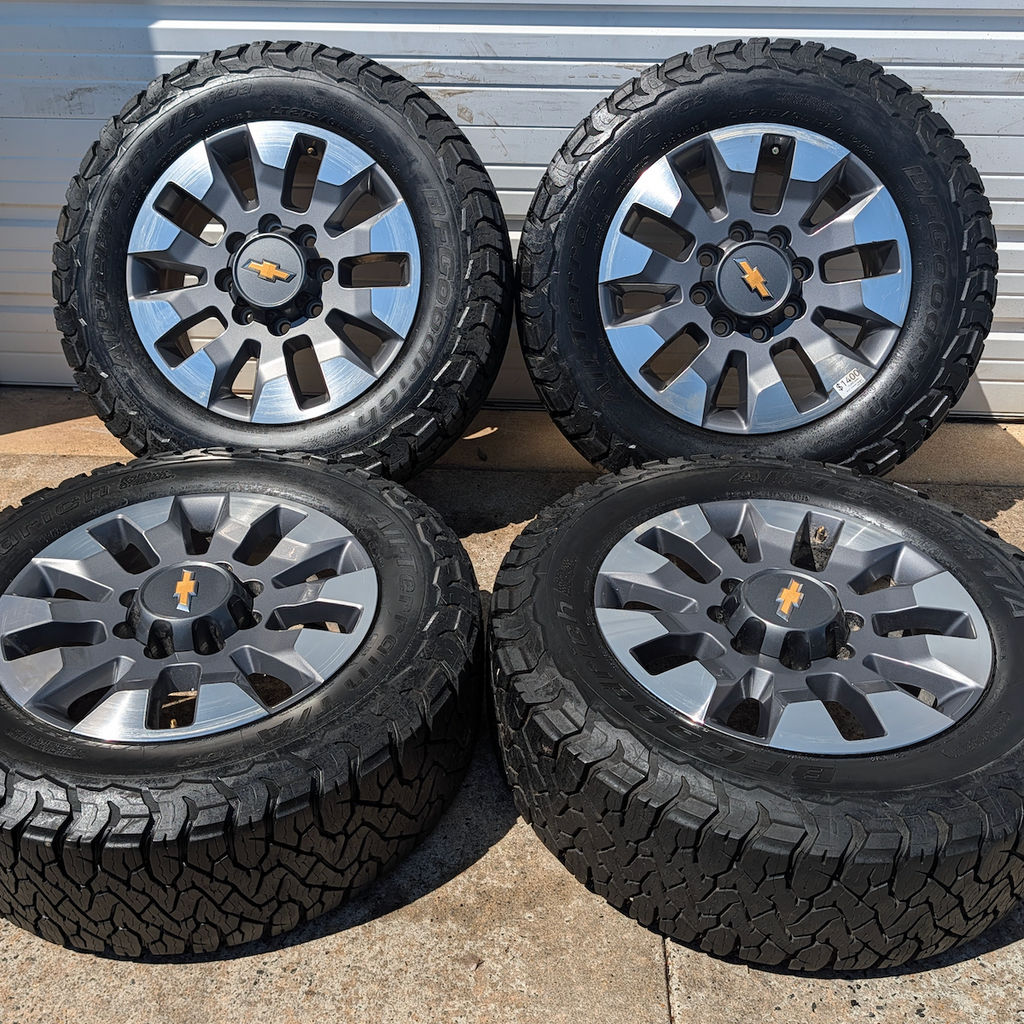 OEM 20” Chevrolet Silverado 2500HD / 3500HD Wheels with Machined Grey Finish wrapped in LT275/65R20 BFGoodrich All-Terrain T/A KO3 tires.
