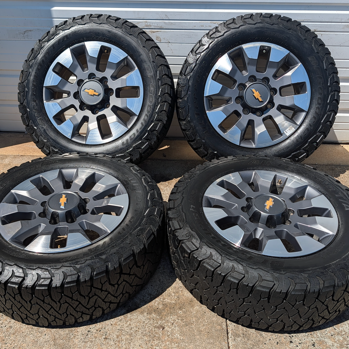 OEM 20” Chevrolet Silverado 2500HD / 3500HD Wheels with Machined Grey Finish wrapped in LT275/65R20 BFGoodrich All-Terrain T/A KO3 tires.