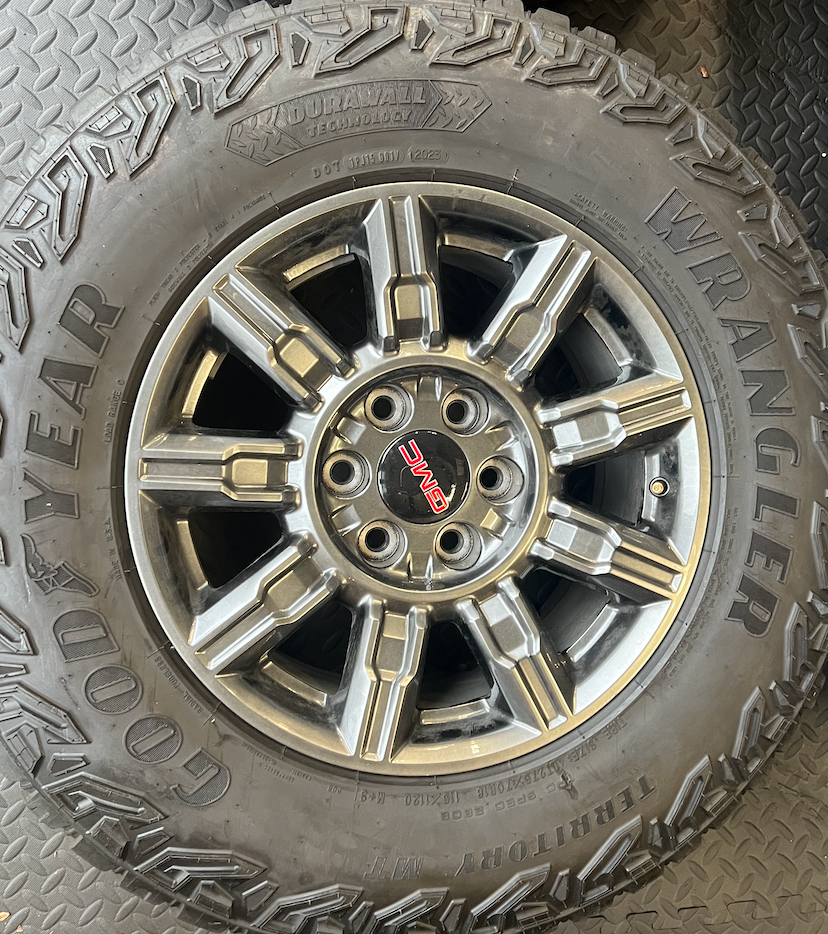 OEM 18” AT4X machined aluminum Wheels wrapped in Goodyear Wrangler Territory M/T tires.
