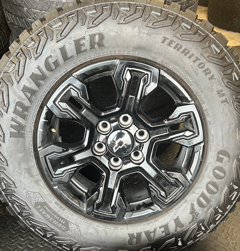 OEM 18” Gloss Black Chevrolet Silverado ZR2 Wheels wrapped in LT275/70R18 Goodyear Wrangler Territory MT tires.