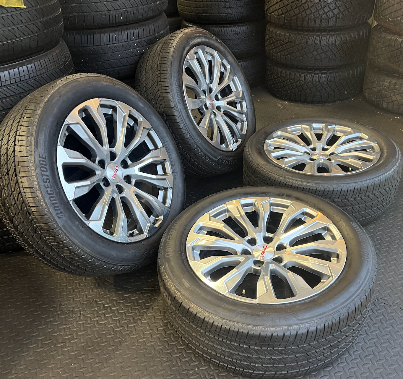 OEM 22” Denali Wheels with Machined & Grey Finish wrapped in Bridgestone tires.