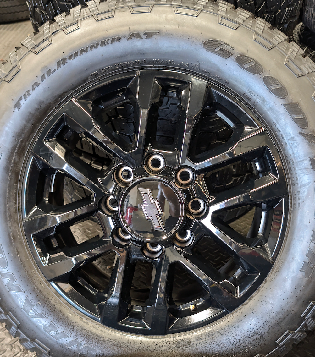 Gloss Black GM 2500HD / 3500HD OEM 20” Wrapped in Goodyear Wrangler TrailRunner A/T LT275/65R20