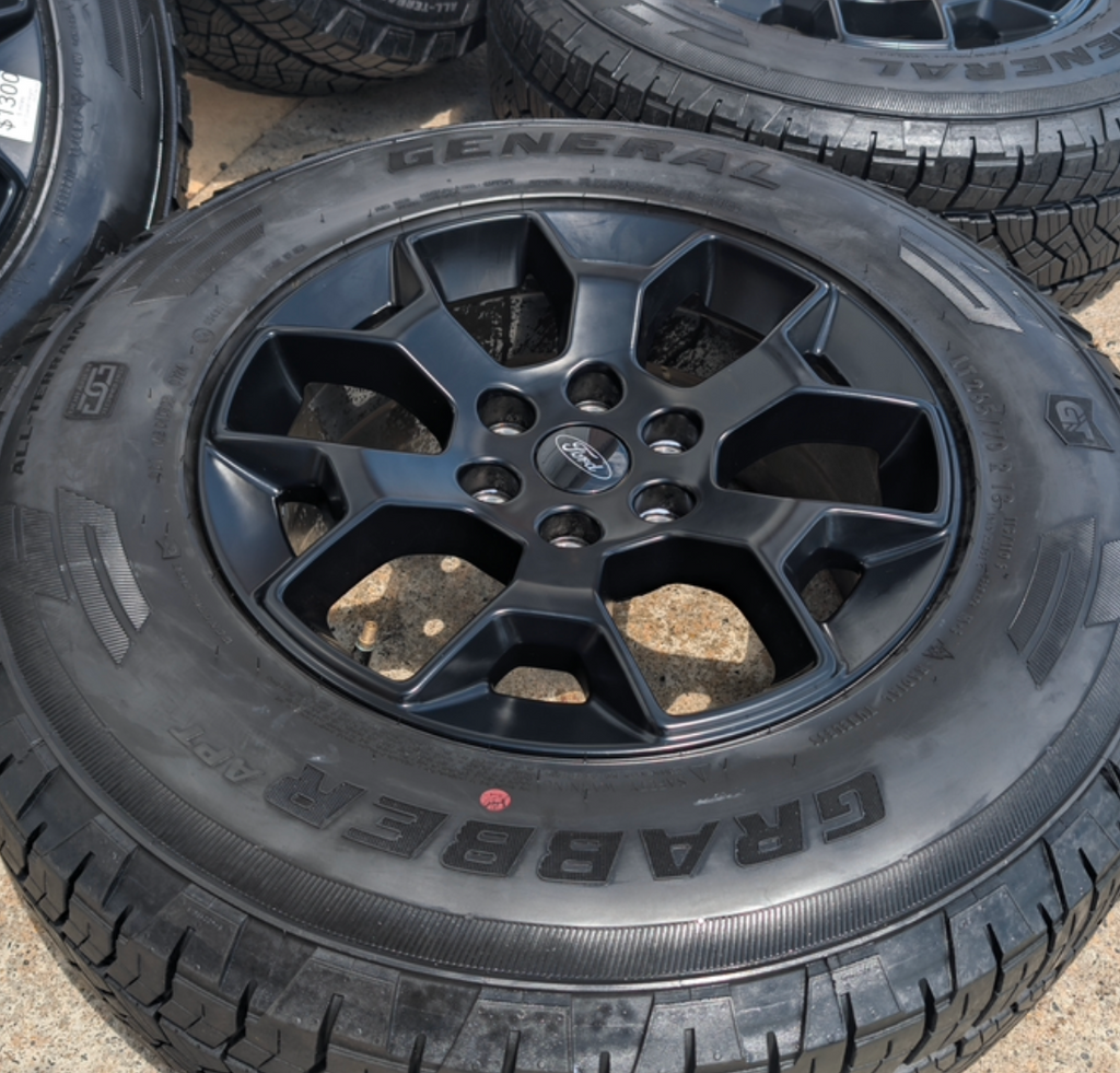 Matte Black Ford F-150 Tremor OEM 18” Wrapped in General Grabber APT LT265/70R18
