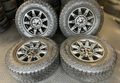 OEM 18" at4x machined aluminum Wheels wrapped in Goodyear tires.