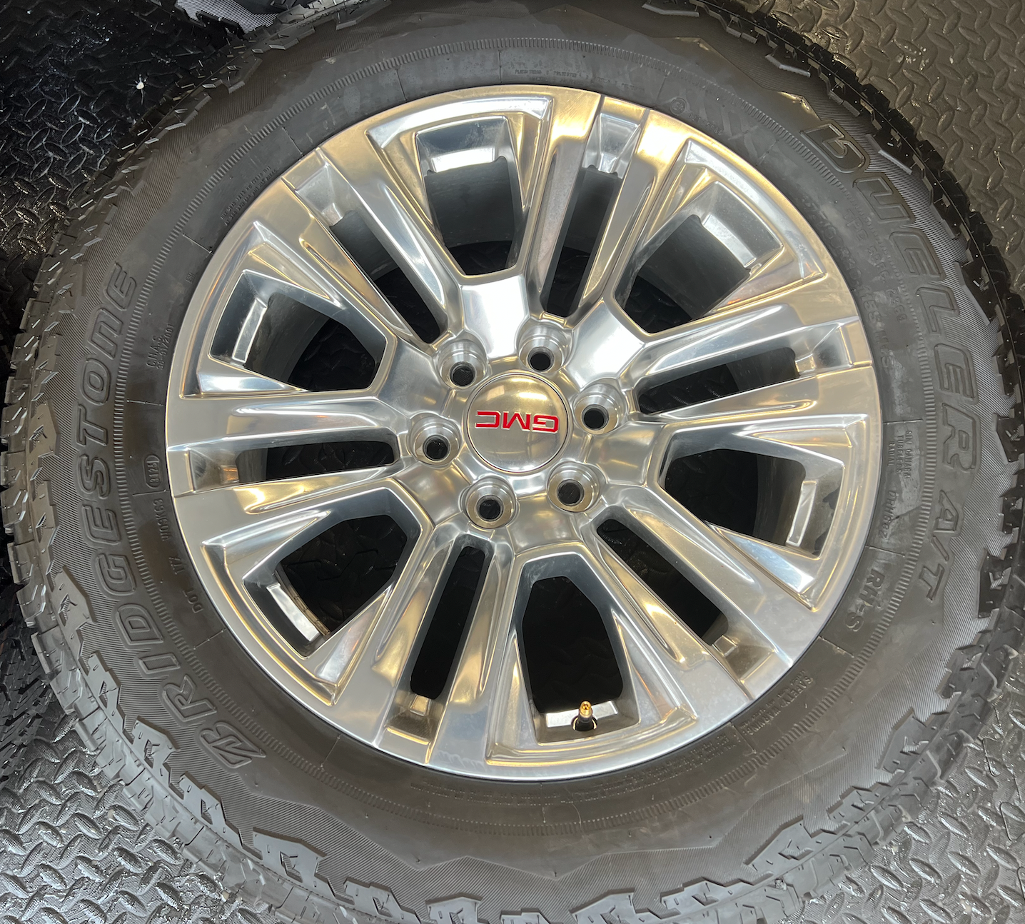 OEM Rebuilt 20” Polished Wheels wrapped in Bridgestone Dueler tires.