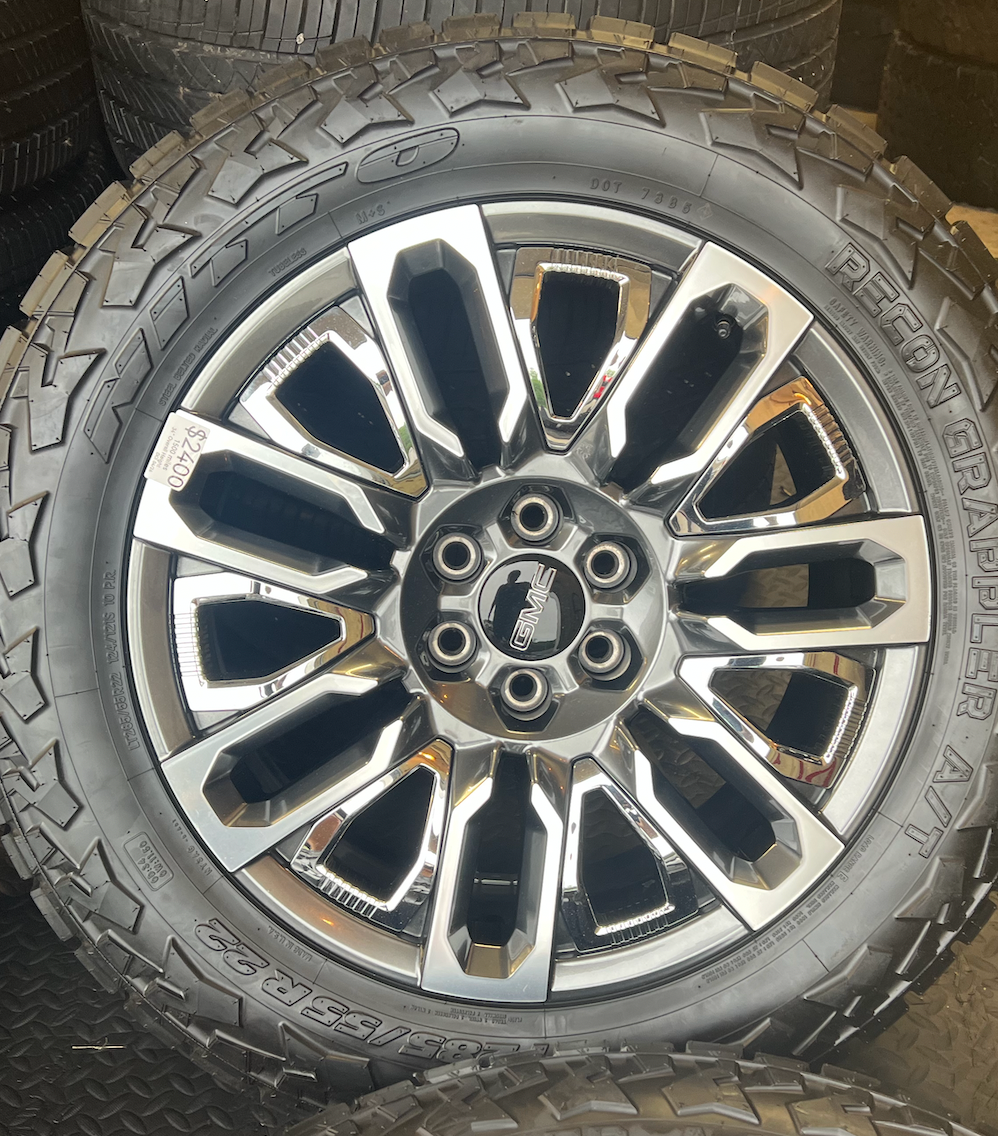 OEM 22”  Denali Ultimate Wheels with Charcoal Machined Finish & Chrome Inserts wrapped in Nitto Recon Grappler A/T tires.