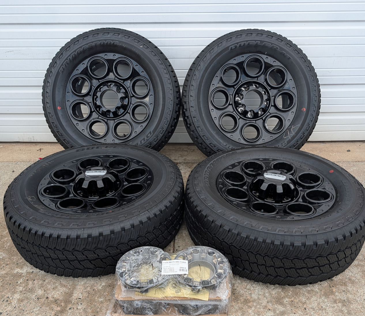 Gloss Black Ford F-250 / F-350 Super Duty Tremor OEM 20” Wrapped in Bridgestone Dueler A/T LT275/65R20