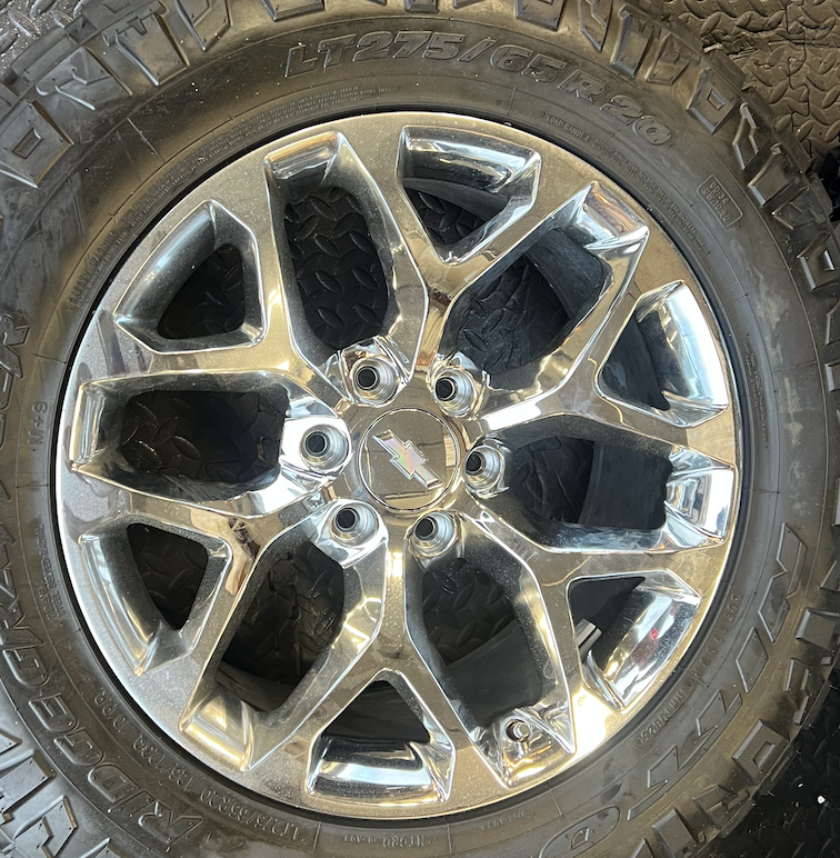 OEM 20” Chrome Truck Wheels wrapped in Nitto Ridge Grappler tires.