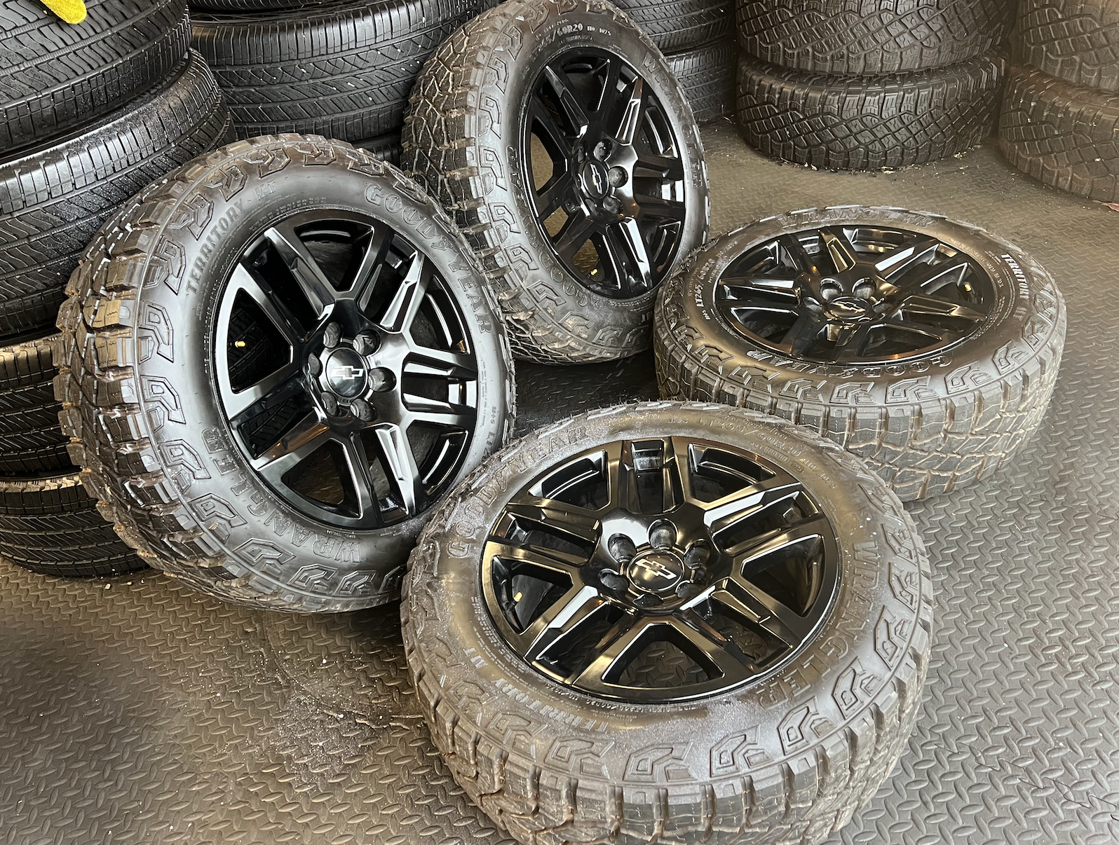 OEM 20” Gloss Black Trail Boss Wheels wrapped in Goodyear Wrangler Territory MT tires.