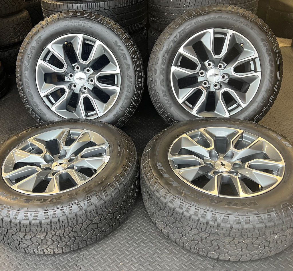 OEM 20”  Gunmetal & Machined Wheels wrapped in Goodyear Wrangler TrailRunner A/T tires.