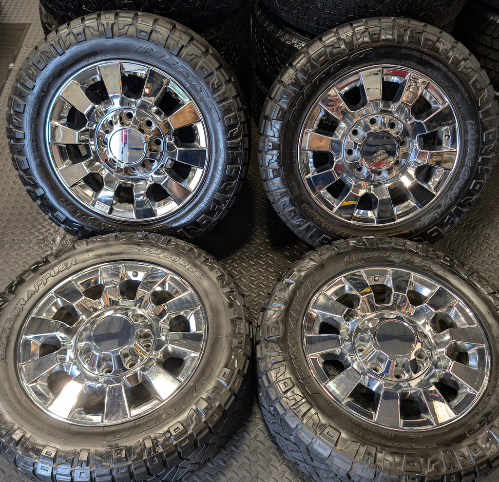 OEM 20” Chrome GMC Sierra Denali 2500HD / 3500HD Wheels wrapped in LT275/60R20 Nitto Ridge Grappler tires.