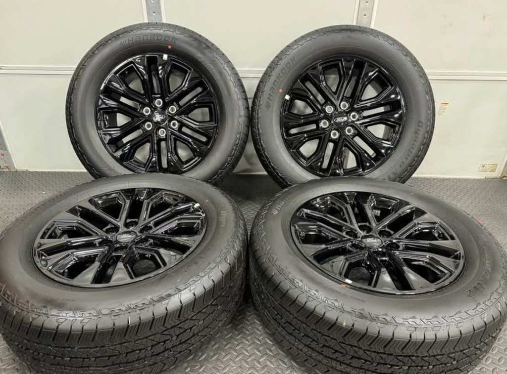 2026 F-150 Lariat black appearance OEM wheels wrapped in 275/60/20 Hankook Dynapro at2 tires