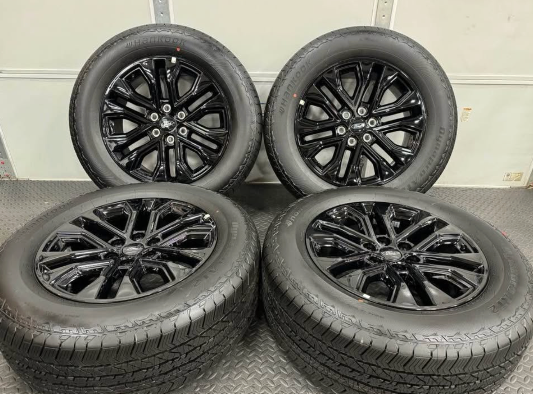 2026 F-150 Lariat black appearance OEM wheels wrapped in 275/60/20 Hankook Dynapro at2 tires