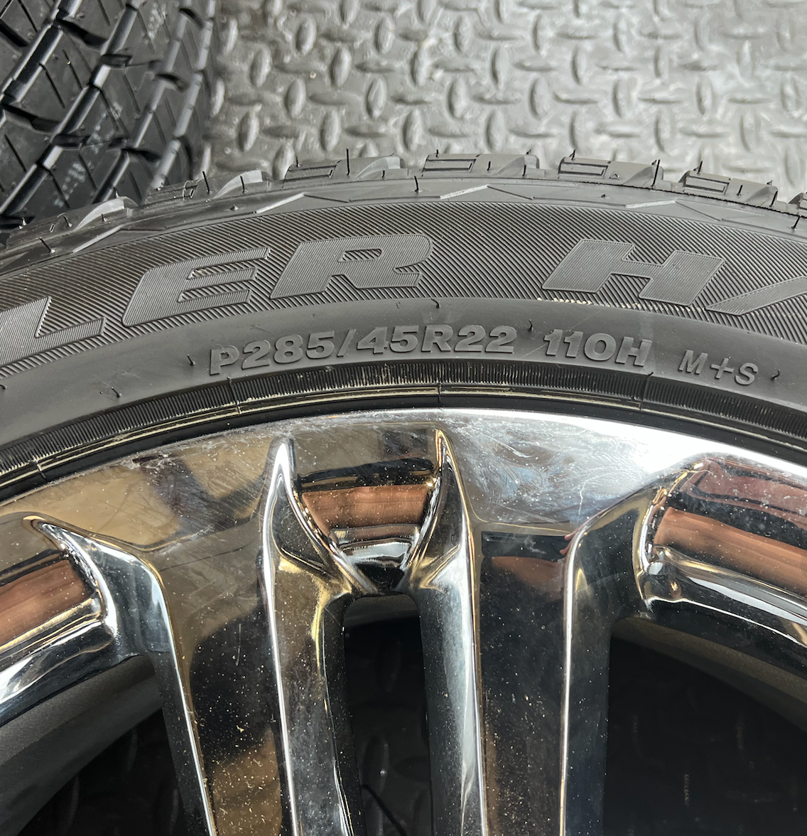OEM 22” Split 6 Chrome Wheels wrapped in Bridgestone Dueler H/L Alenza tires.