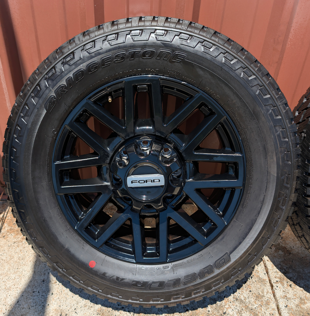 OEM 20” Chevrolet Silverado RST Gunmetal & Machined Wheels wrapped in Goodyear Wrangler TrailRunner A/T tires.
