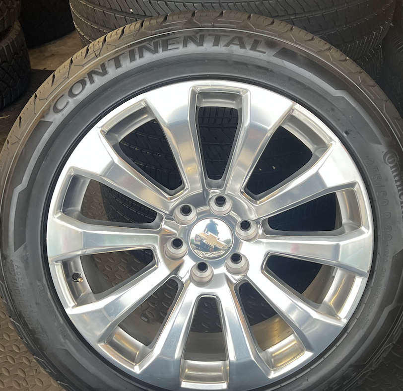 OEM 22”  High Country Polished Aluminum Wheels wrapped in Continental TerrainContact tires.
