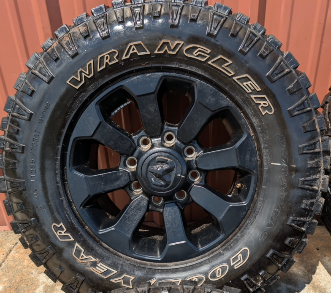 Matte Black Ram 2500 / 3500 Power Wagon OEM 17” Wrapped in Goodyear Wrangler DuraTrac LT285/70R17