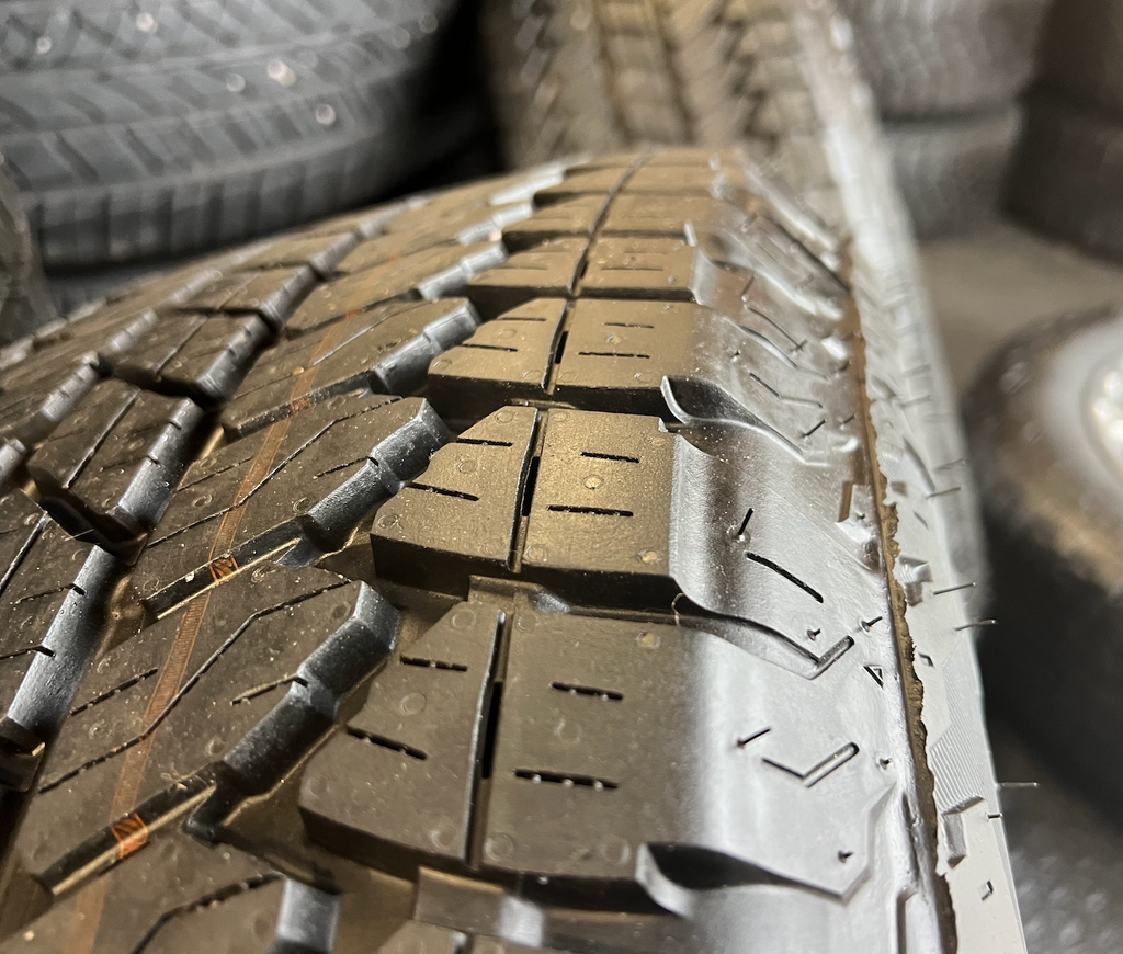 OEM Rebuilt 20” Polished Wheels wrapped in Bridgestone Dueler tires.