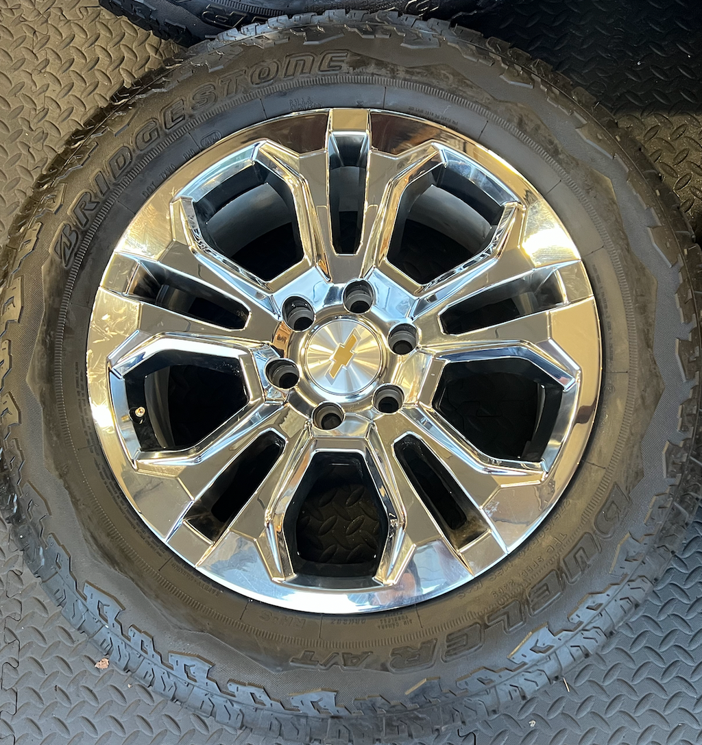 OEM 20” Chrome Wheels wrapped in Bridgestone Dueler tires.