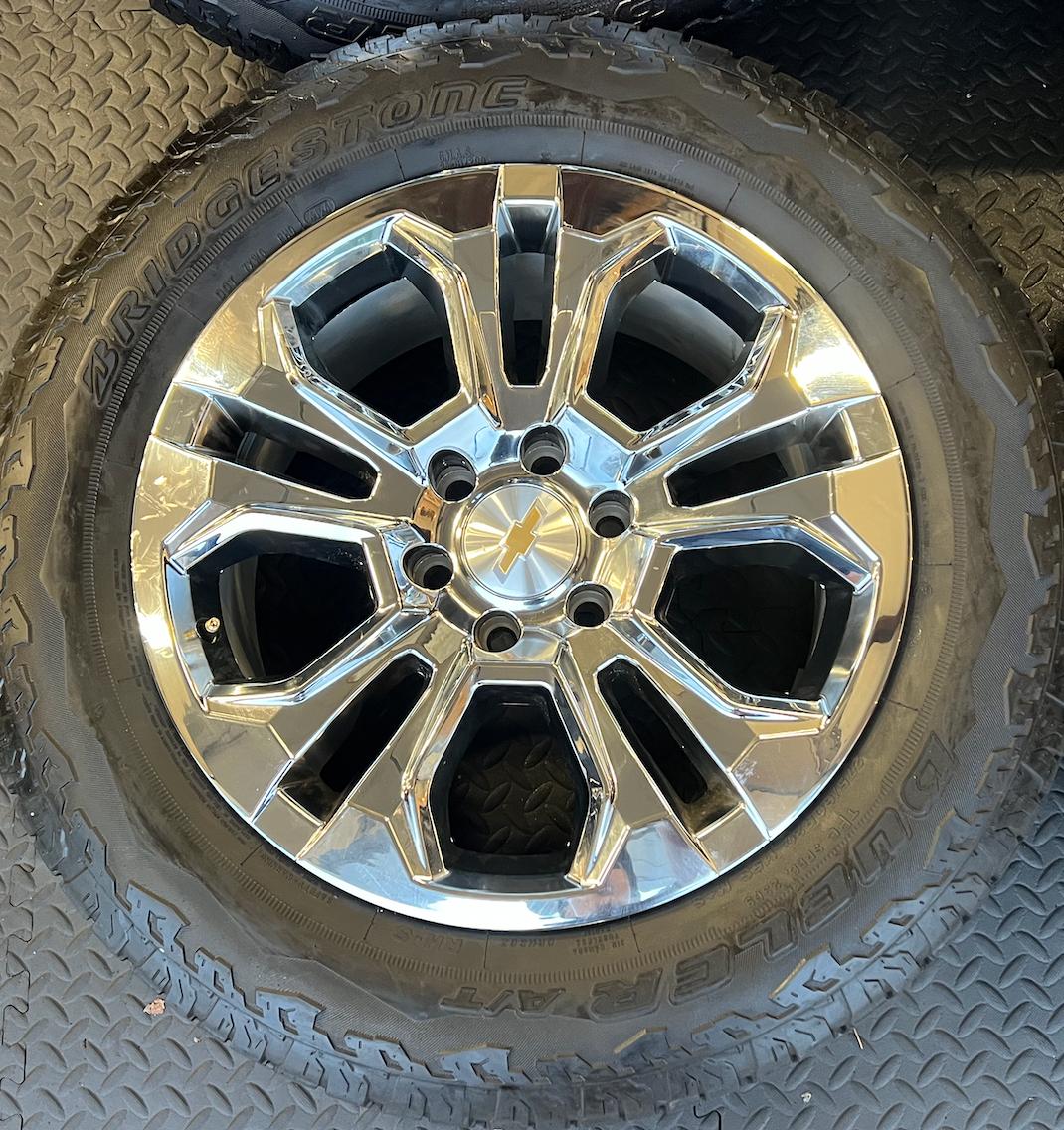 OEM 20” Chrome Wheels wrapped in Bridgestone Dueler tires.