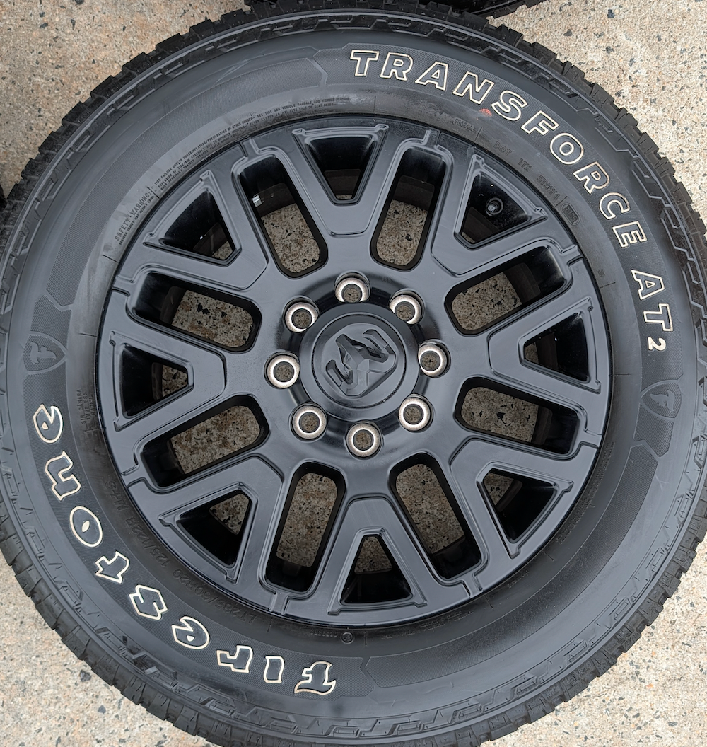 Matte Black Ram 2500 / 3500 OEM 20” Wrapped in Firestone Transforce AT2 LT285/60R20