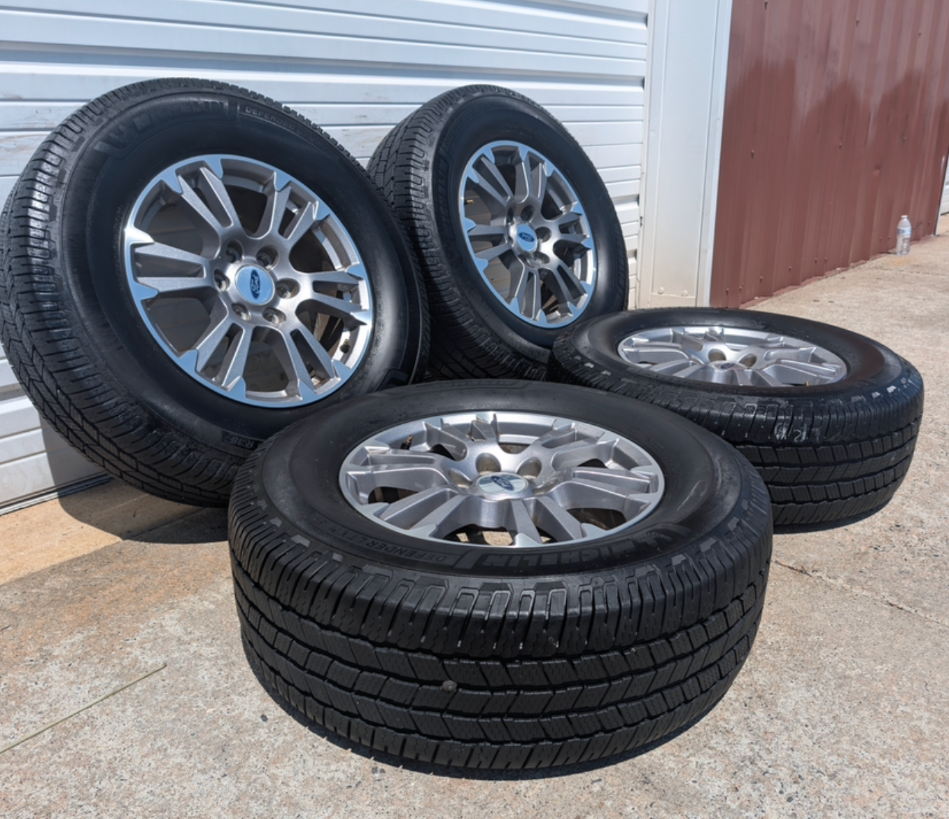 Gray Machined Ford F-150 Lariat OEM 18” Wrapped in Michelin Defender LTX 275/65R18