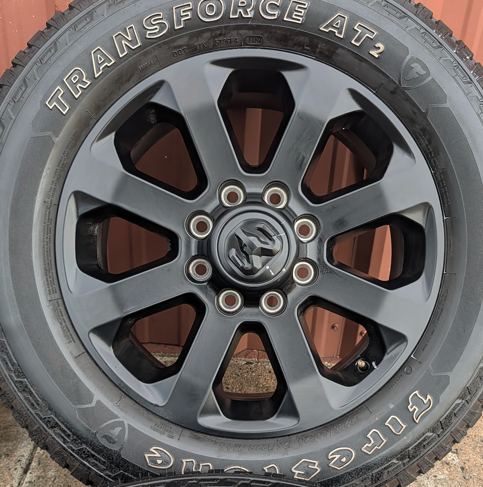 Matte Black Ram 2500 / 3500 OEM 20” Wrapped in Firestone Transforce AT2 LT285/60R20
