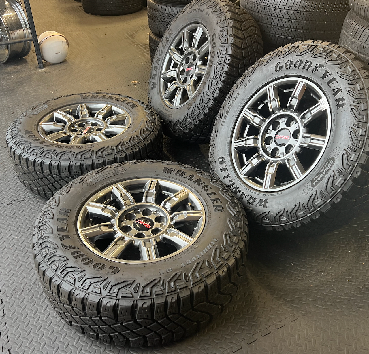 OEM 18” AT4X machined aluminum Wheels wrapped in Goodyear Wrangler Territory M/T tires.