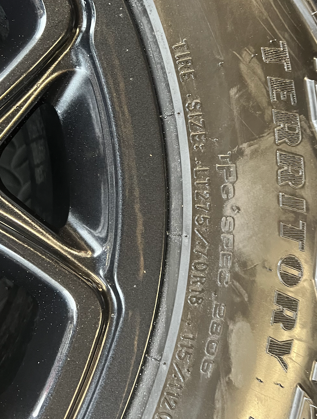 OEM 18”  Wheels wrapped in Goodyear Wrangler Territory M/T tires.