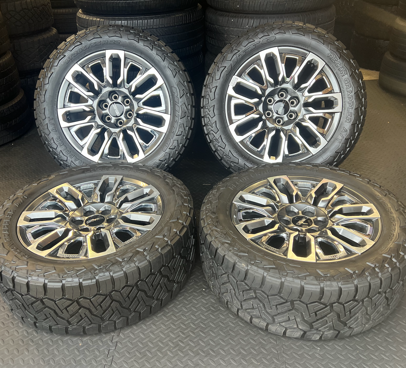 OEM 22”  Denali Ultimate Wheels with Charcoal Machined Finish & Chrome Inserts wrapped in Nitto Recon Grappler A/T tires.