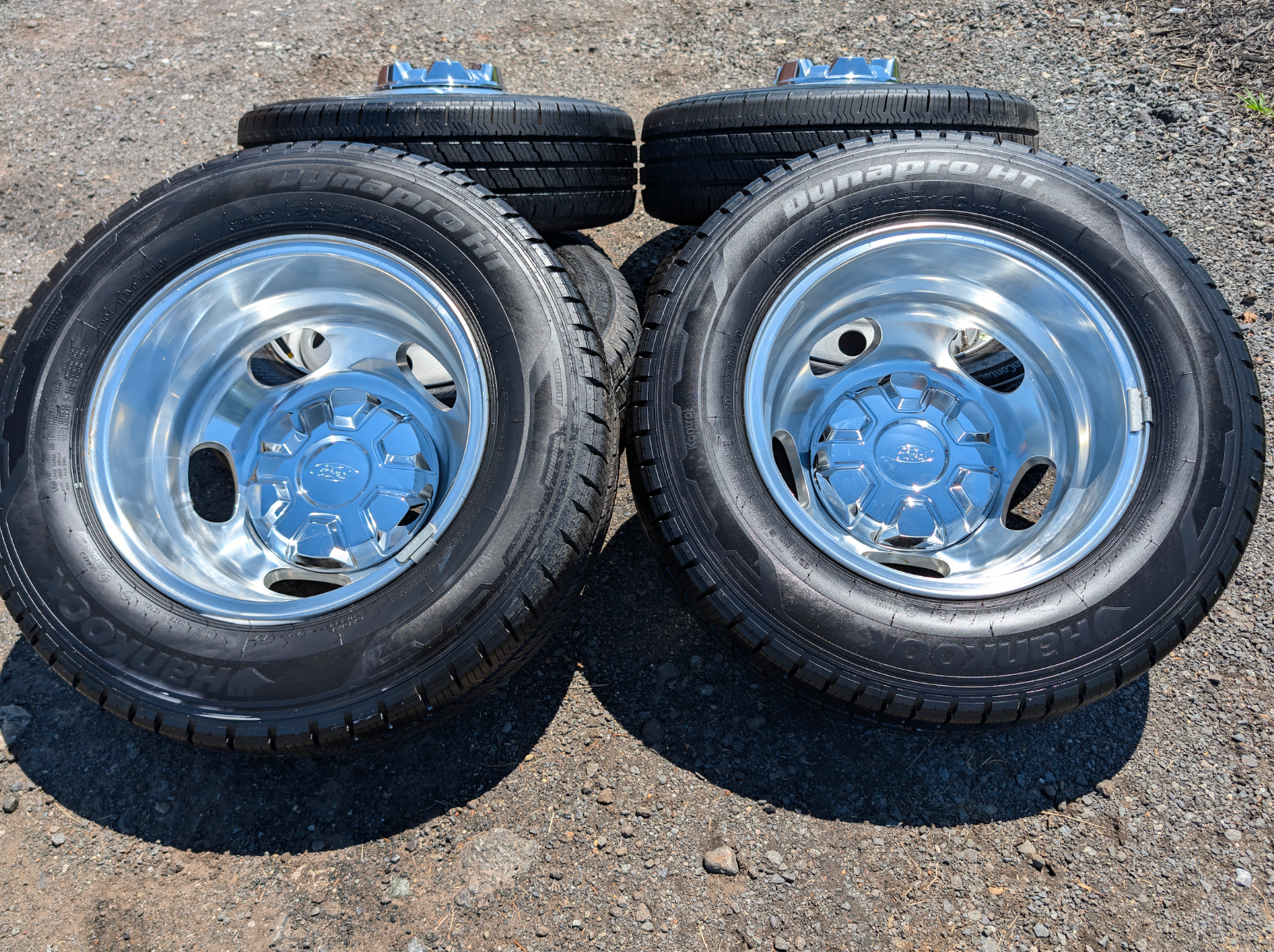 OEM 16” Polished Ford Transit Dual Rear Wheel (Dually) Wheels wrapped in 205/75R16 Hankook Dynapro HT tires.