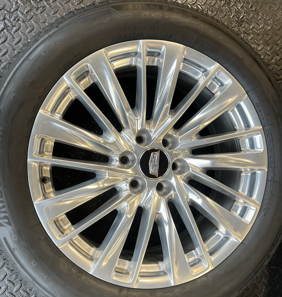 OEM 22” Polished Aluminum Wheels wrapped in Bridgestone tires.