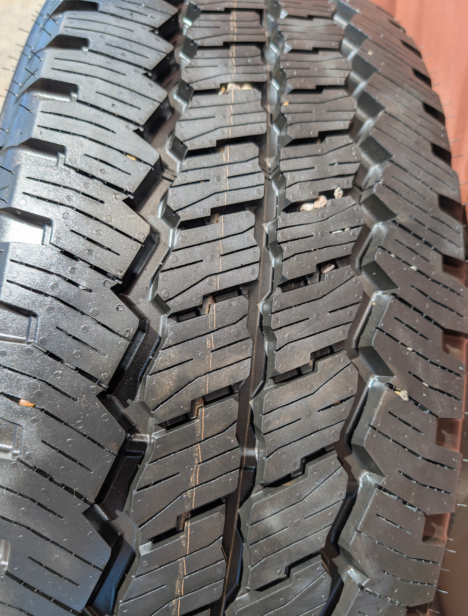 OEM 20” Chevrolet Silverado RST Gunmetal & Machined Wheels wrapped in Goodyear Wrangler TrailRunner A/T tires.
